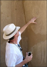 Traveler points out a "Flower of Life" inscription